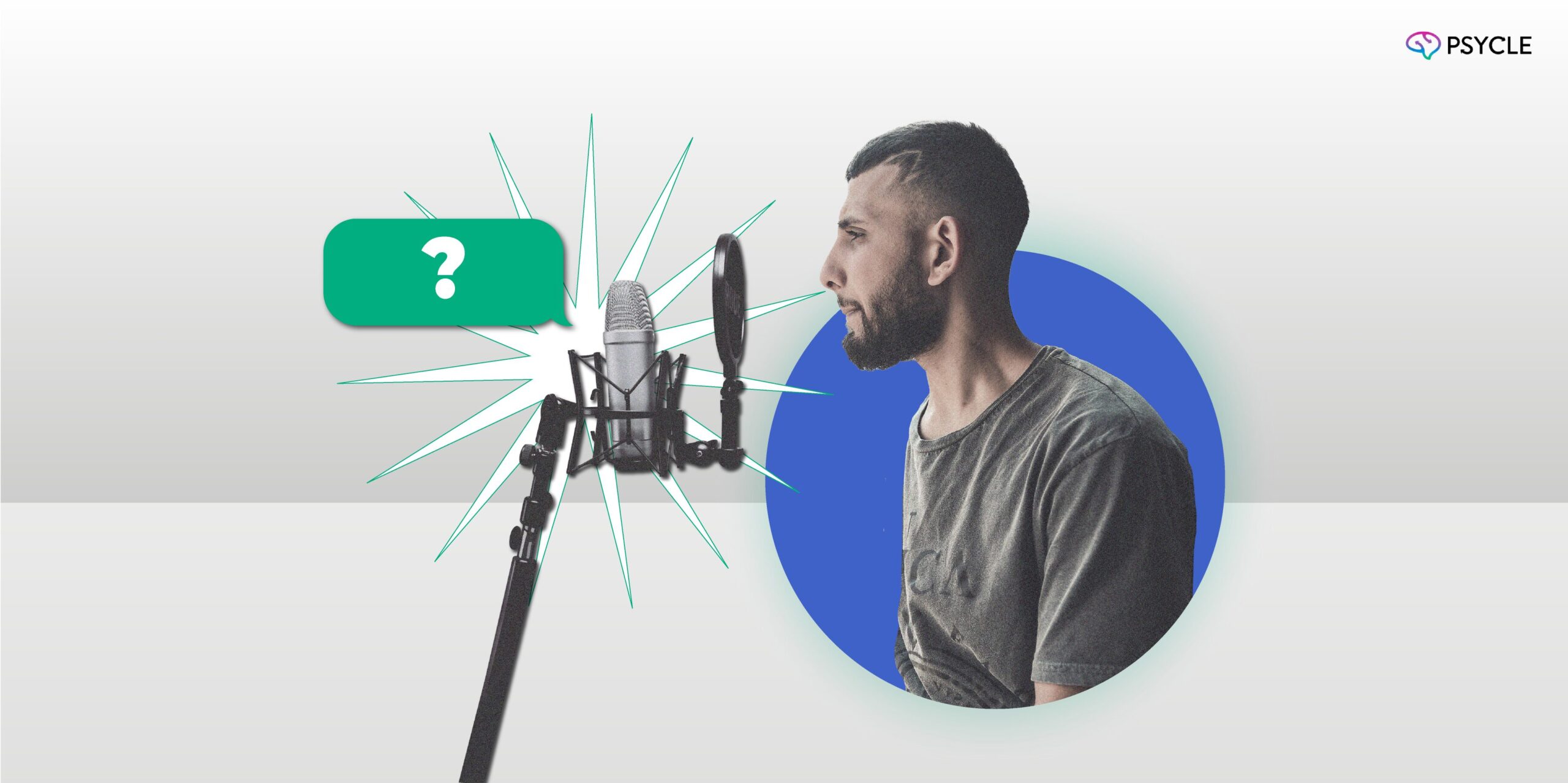 Man speaking to a recording microphone.